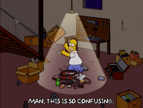 Gif of Homer confusingly sorting through stuff